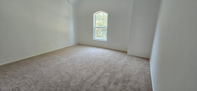 unfurnished room with light colored carpet