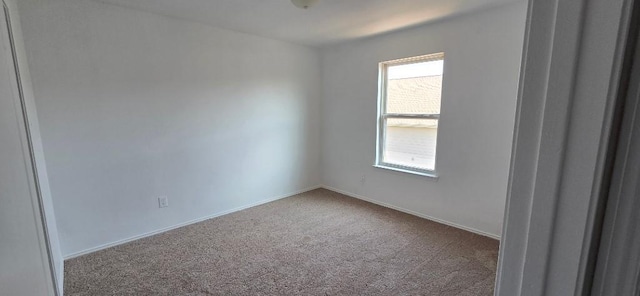 empty room with carpet flooring