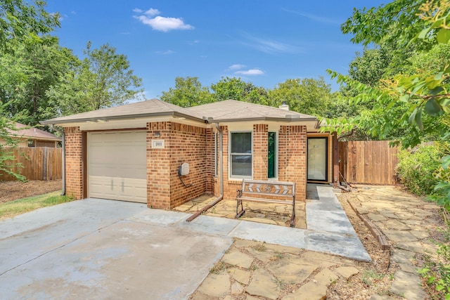 single story home with a garage