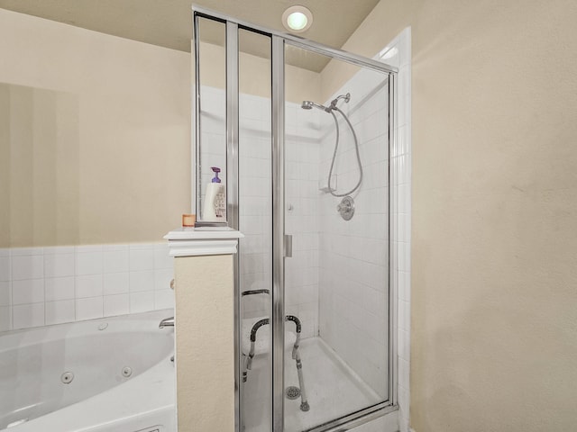 bathroom with shower with separate bathtub