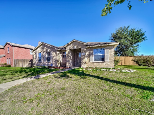 ranch-style house with a front lawn