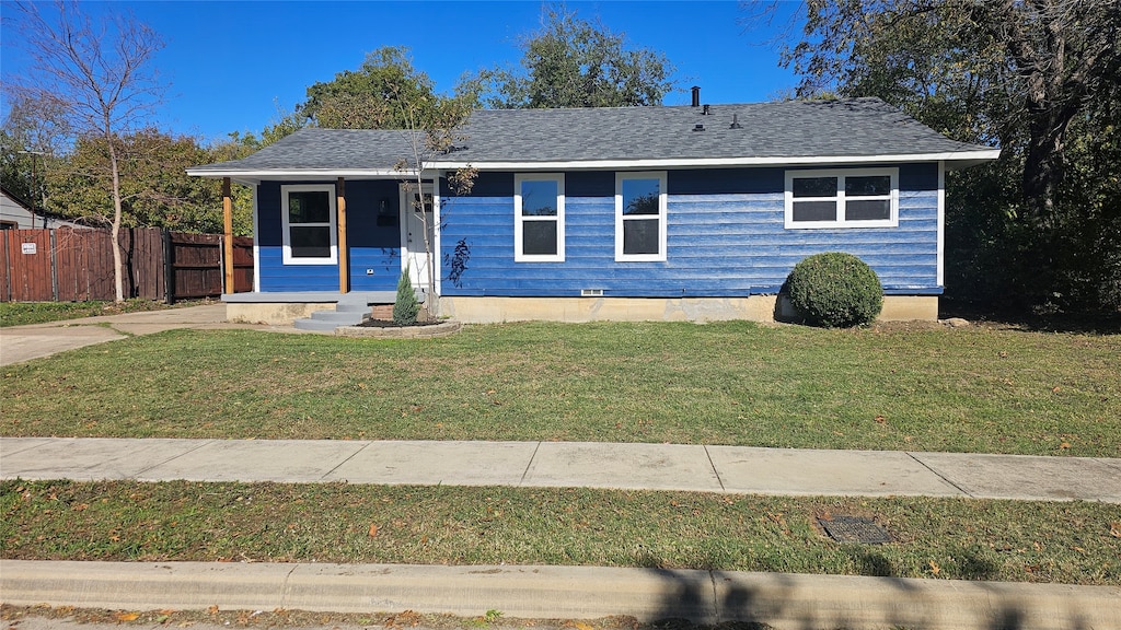 ranch-style home with a front lawn