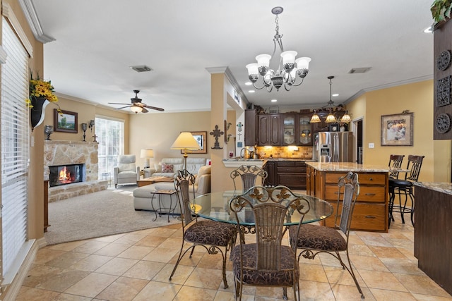 kitchen featuring a kitchen bar, a center island, dark brown cabinetry, and black appliances