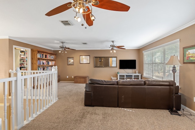 living room featuring light colored carpet, ceiling fan, and ornamental molding