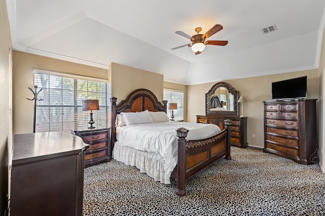 carpeted bedroom featuring ceiling fan, lofted ceiling, and crown molding