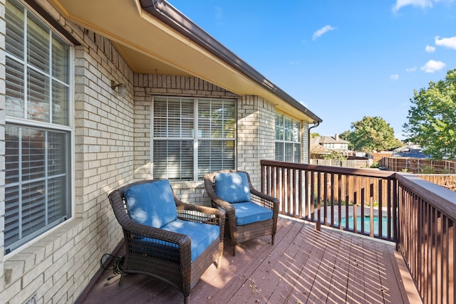 deck featuring a swimming pool