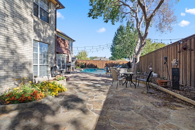 view of patio featuring a fenced in pool