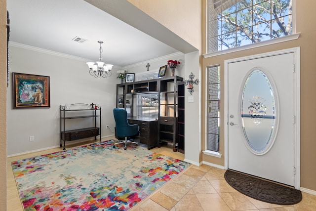 entrance foyer featuring tile patterned floors, an inviting chandelier, and ornamental molding