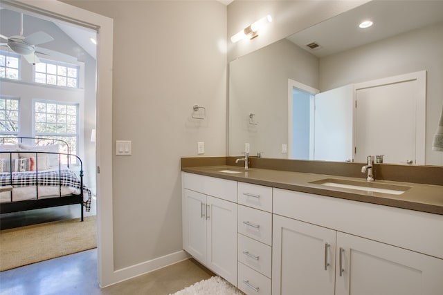 bathroom featuring vanity, concrete floors, ceiling fan, and lofted ceiling