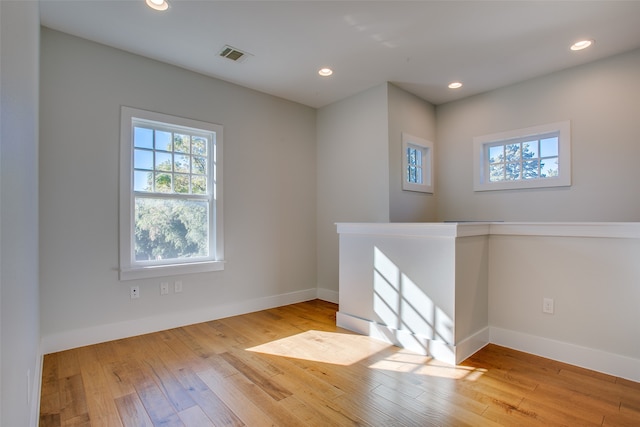 spare room featuring light hardwood / wood-style floors