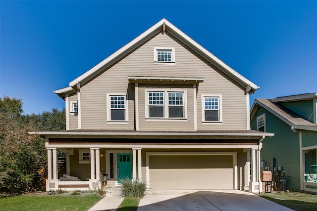 view of front of house featuring covered porch and a garage