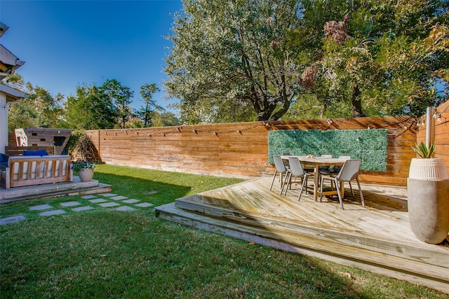 view of yard featuring a wooden deck