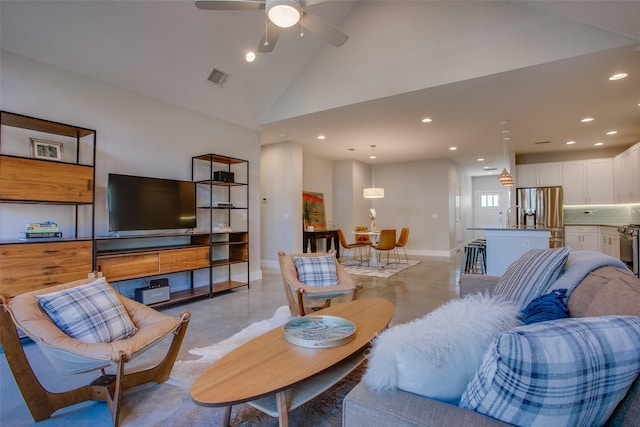 living room featuring ceiling fan, sink, and high vaulted ceiling