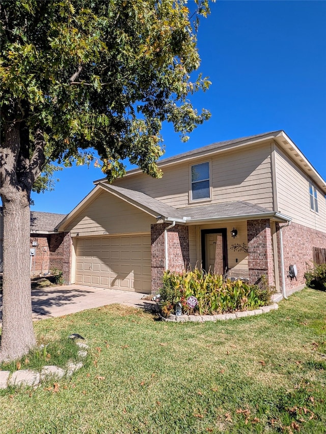 view of front of house with a front yard and a garage