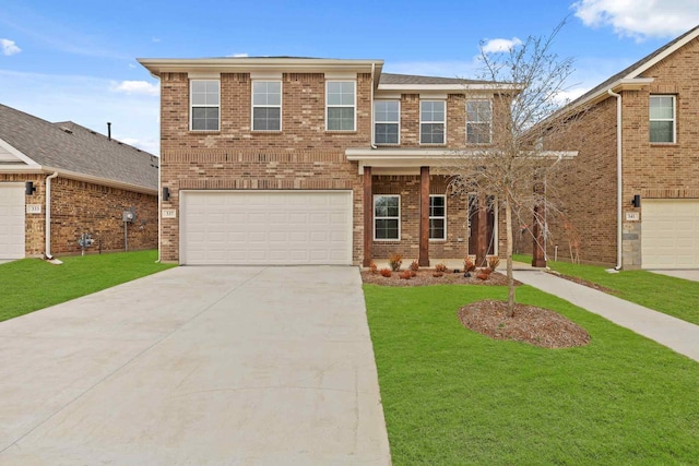 view of front of home with brick siding, a garage, concrete driveway, and a front lawn