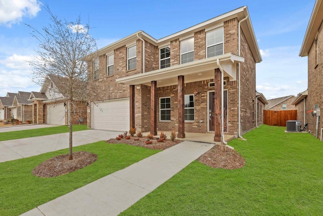 view of front of house featuring a garage, a front yard, covered porch, and cooling unit