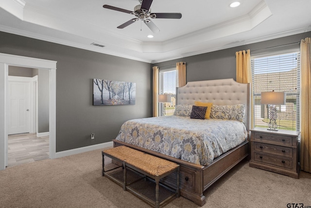 bedroom featuring ceiling fan, crown molding, and multiple windows