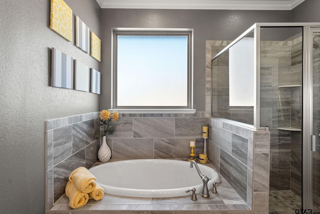 bathroom featuring separate shower and tub, plenty of natural light, and ornamental molding