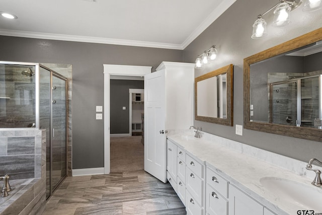 bathroom with vanity, shower with separate bathtub, and crown molding