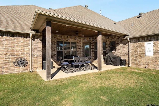 back of house with a lawn, ceiling fan, and a patio