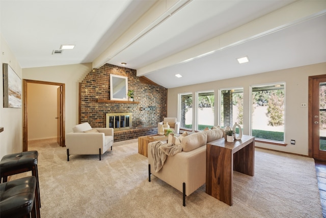 carpeted living room featuring vaulted ceiling with beams and a brick fireplace