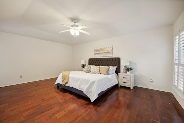 bedroom with ceiling fan and dark hardwood / wood-style flooring