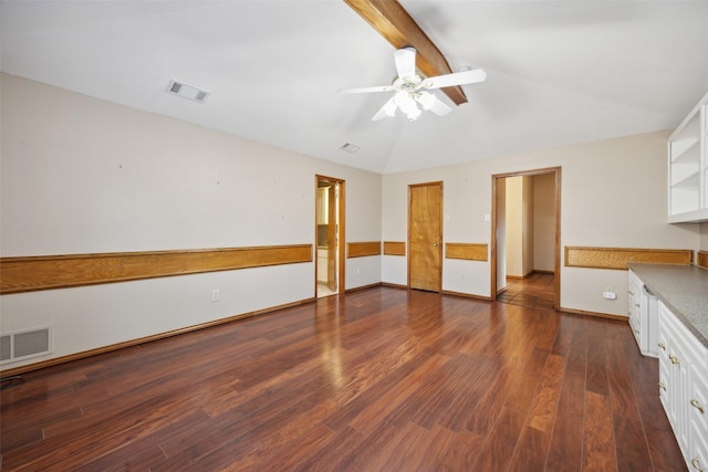 interior space with vaulted ceiling with beams, ceiling fan, and dark hardwood / wood-style flooring