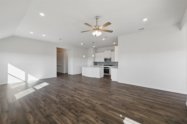 unfurnished living room featuring recessed lighting, visible vents, dark wood finished floors, and ceiling fan