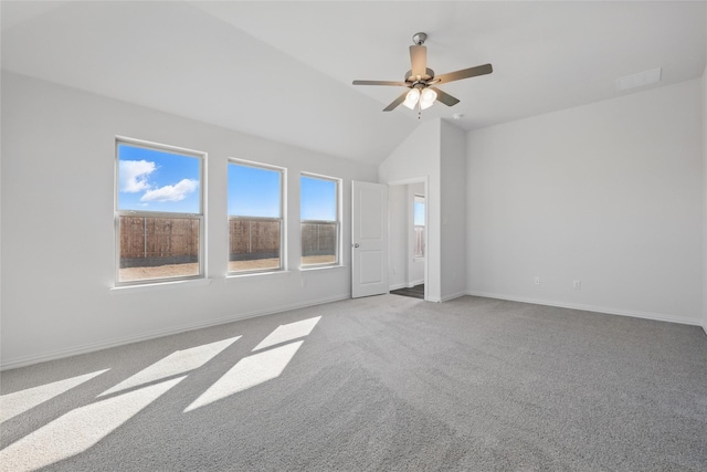 unfurnished room featuring a ceiling fan, lofted ceiling, carpet flooring, and baseboards