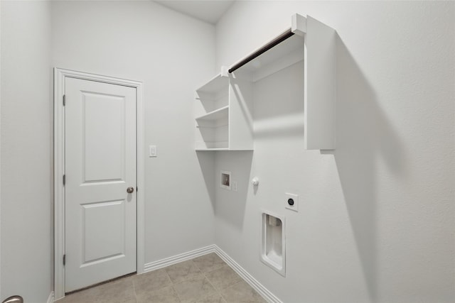 clothes washing area featuring laundry area, baseboards, gas dryer hookup, hookup for an electric dryer, and washer hookup