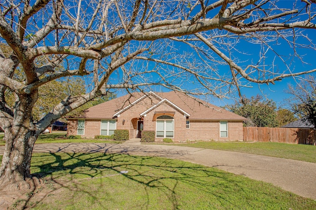 ranch-style house with a front lawn