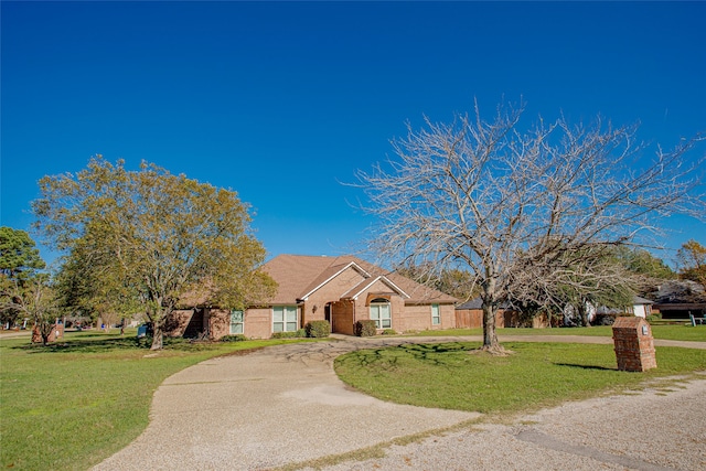 single story home featuring a front yard