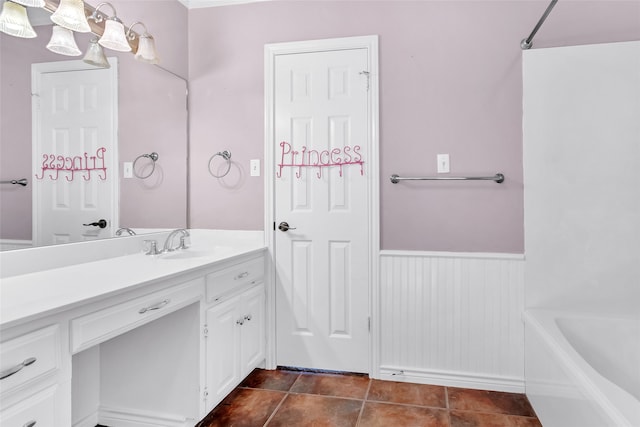 bathroom with tile patterned flooring, vanity, and shower / bathtub combination