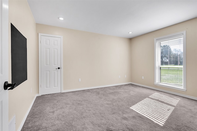 empty room featuring light carpet