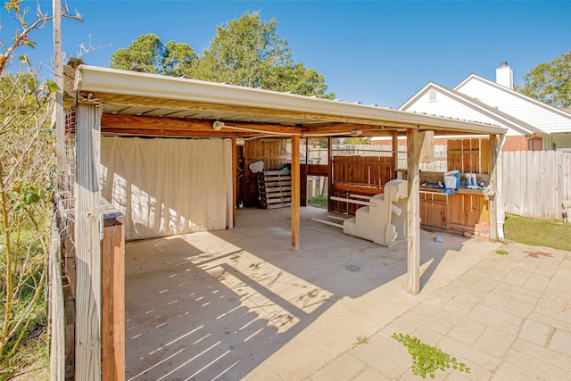 view of patio featuring an outdoor structure