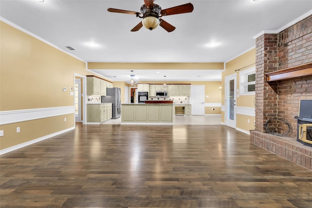 unfurnished living room featuring ceiling fan, dark wood-type flooring, and ornamental molding