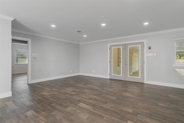 spare room with dark hardwood / wood-style flooring, french doors, and ornamental molding