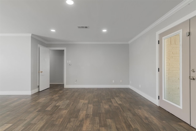 empty room with crown molding and dark hardwood / wood-style flooring