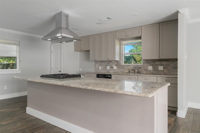 kitchen with island range hood, a kitchen island, dark hardwood / wood-style floors, and crown molding