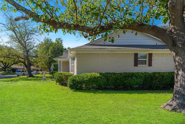 view of property exterior featuring a yard