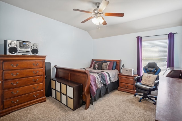 carpeted bedroom with ceiling fan and lofted ceiling