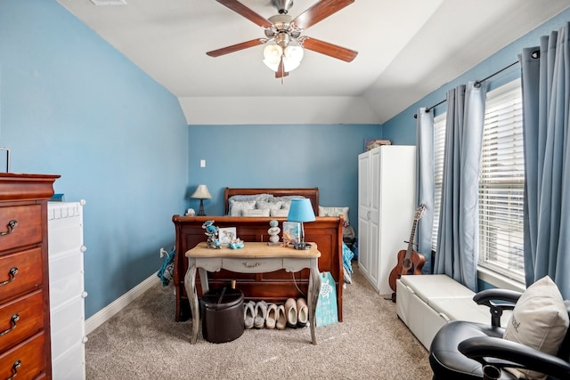 bedroom featuring ceiling fan, light colored carpet, and lofted ceiling