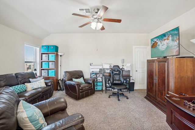 carpeted office space with ceiling fan and vaulted ceiling