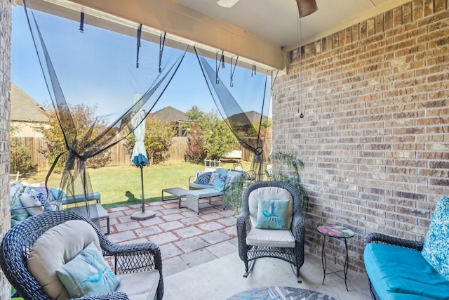 view of patio featuring ceiling fan and an outdoor living space