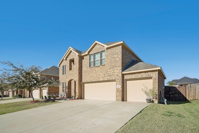 view of front facade with a front lawn and a garage