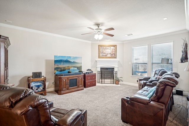 carpeted living room featuring ceiling fan and ornamental molding