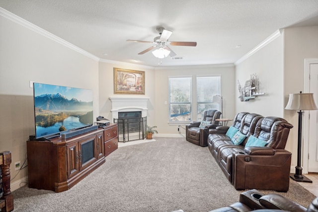 living room with ceiling fan, light colored carpet, and crown molding