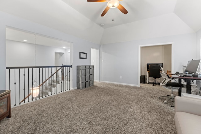 home office with carpet, vaulted ceiling, baseboards, and ceiling fan