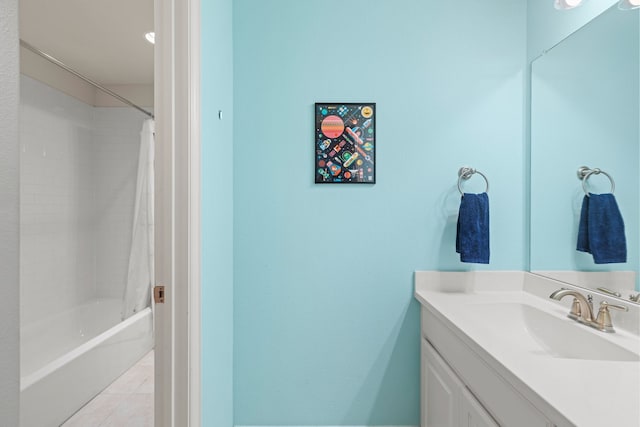 full bathroom featuring shower / bath combo with shower curtain, vanity, and tile patterned floors