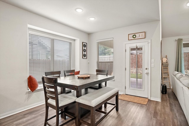 dining area featuring dark hardwood / wood-style floors